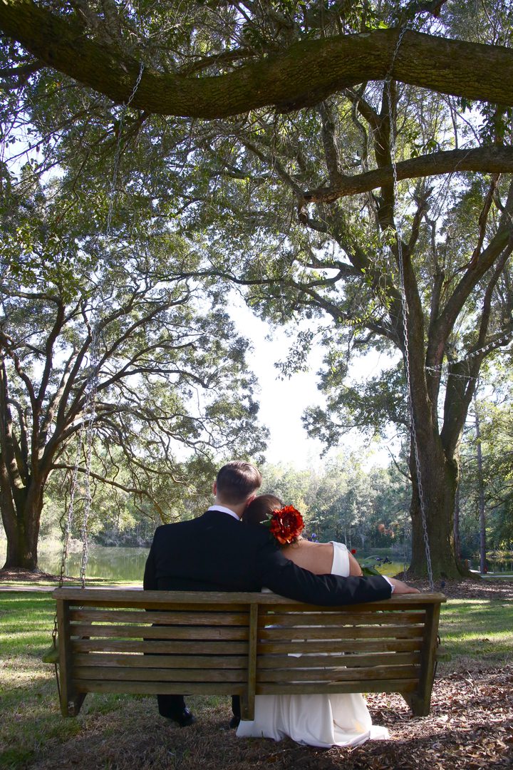Bride and groom on a swing.