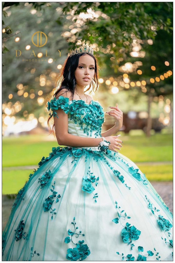 Teenage girl in teal quinceaera dress.