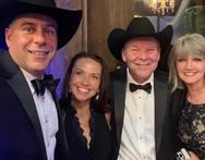 8aaaea3d6820de2b2cf0226db4087b70 Here's an alt tag for the image: Four people in formal wear and cowboy hats.