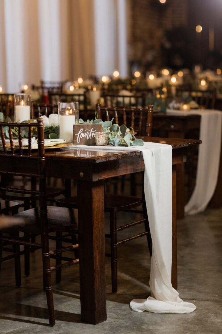 Rustic wedding table, candles, number fourteen.