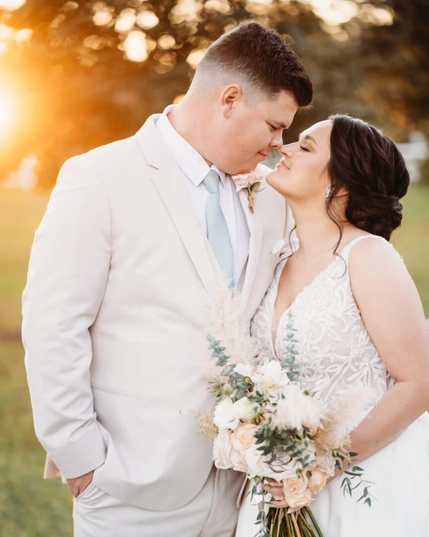 Bride and groom sharing a tender kiss.