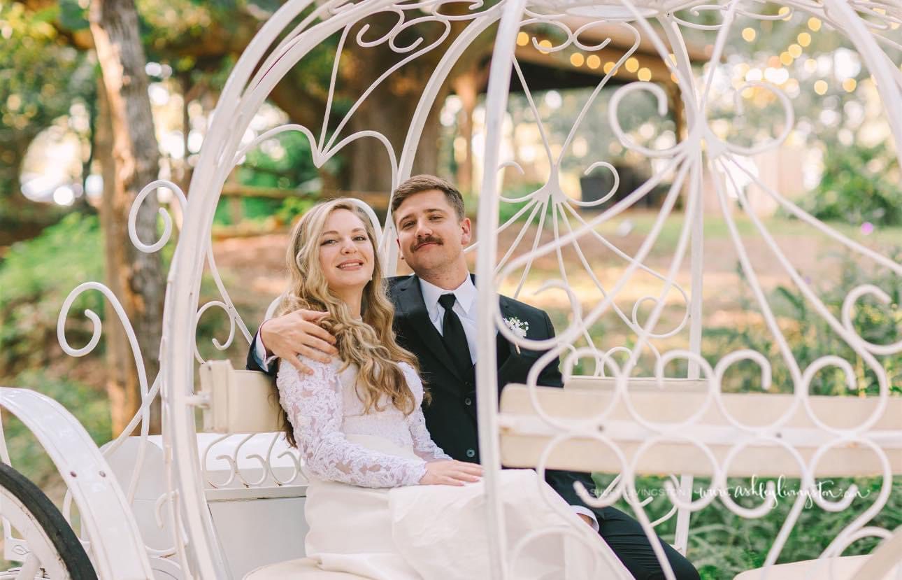Bride and groom in a carriage.