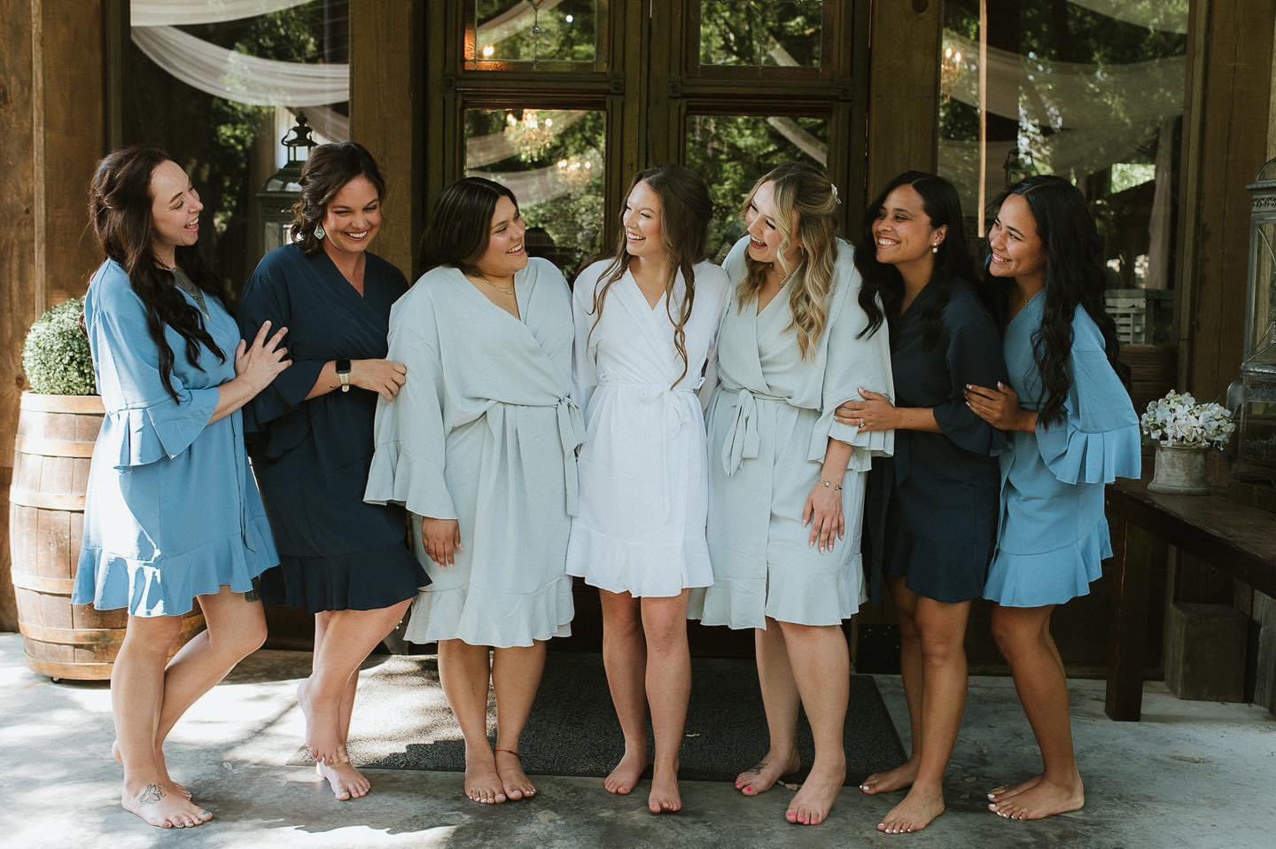 Bride and bridesmaids in robes.