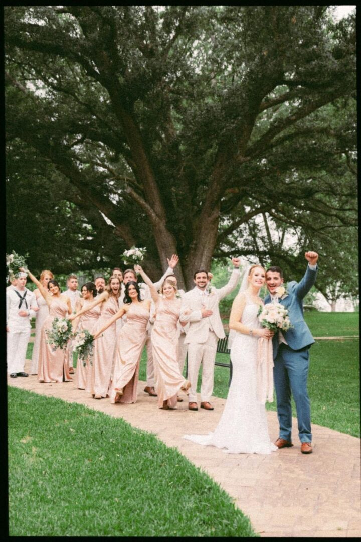 Wedding party under a large tree.