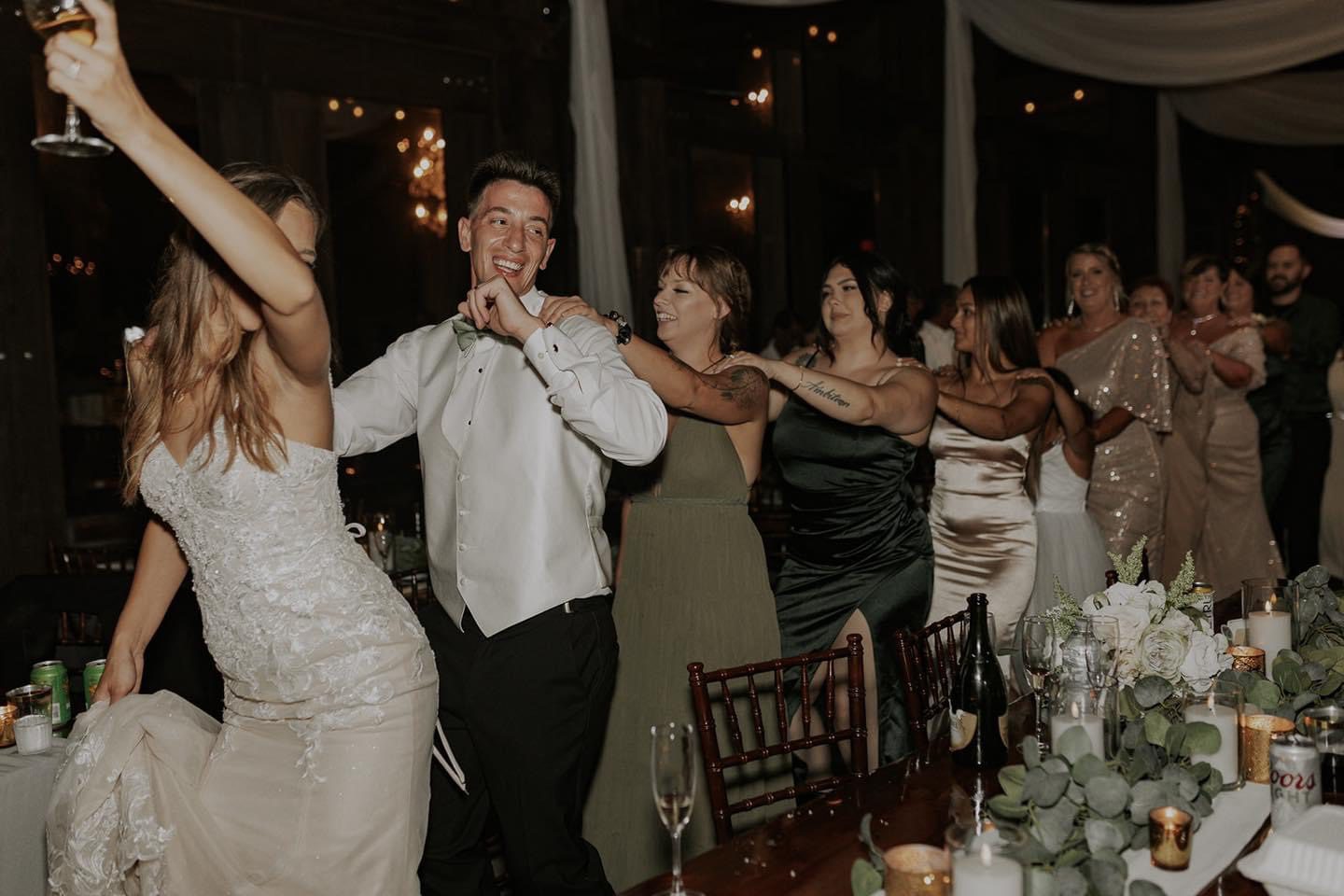 Bride and groom dancing at reception.