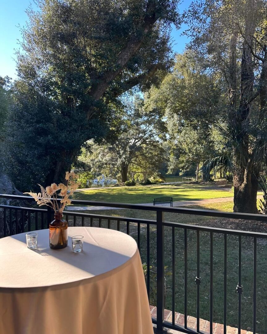 Outdoor table setting with park view.