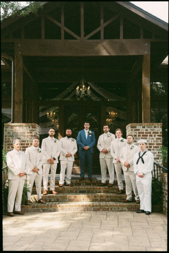 Groom and groomsmen pose for photo.