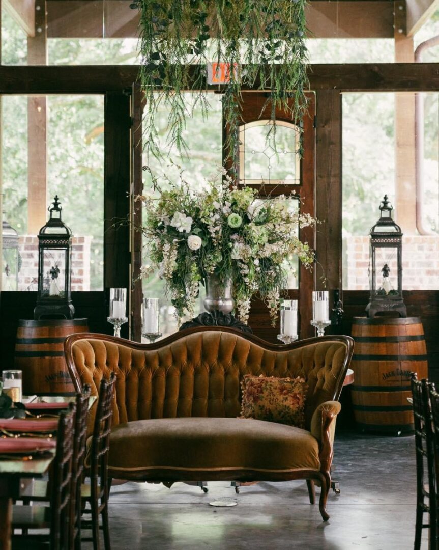 Vintage velvet couch in rustic setting.
