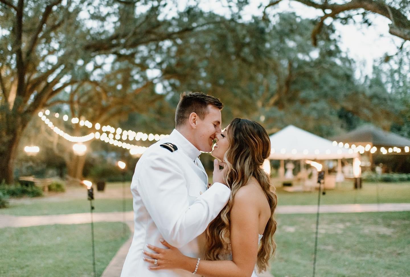 Bride and groom sharing a kiss.