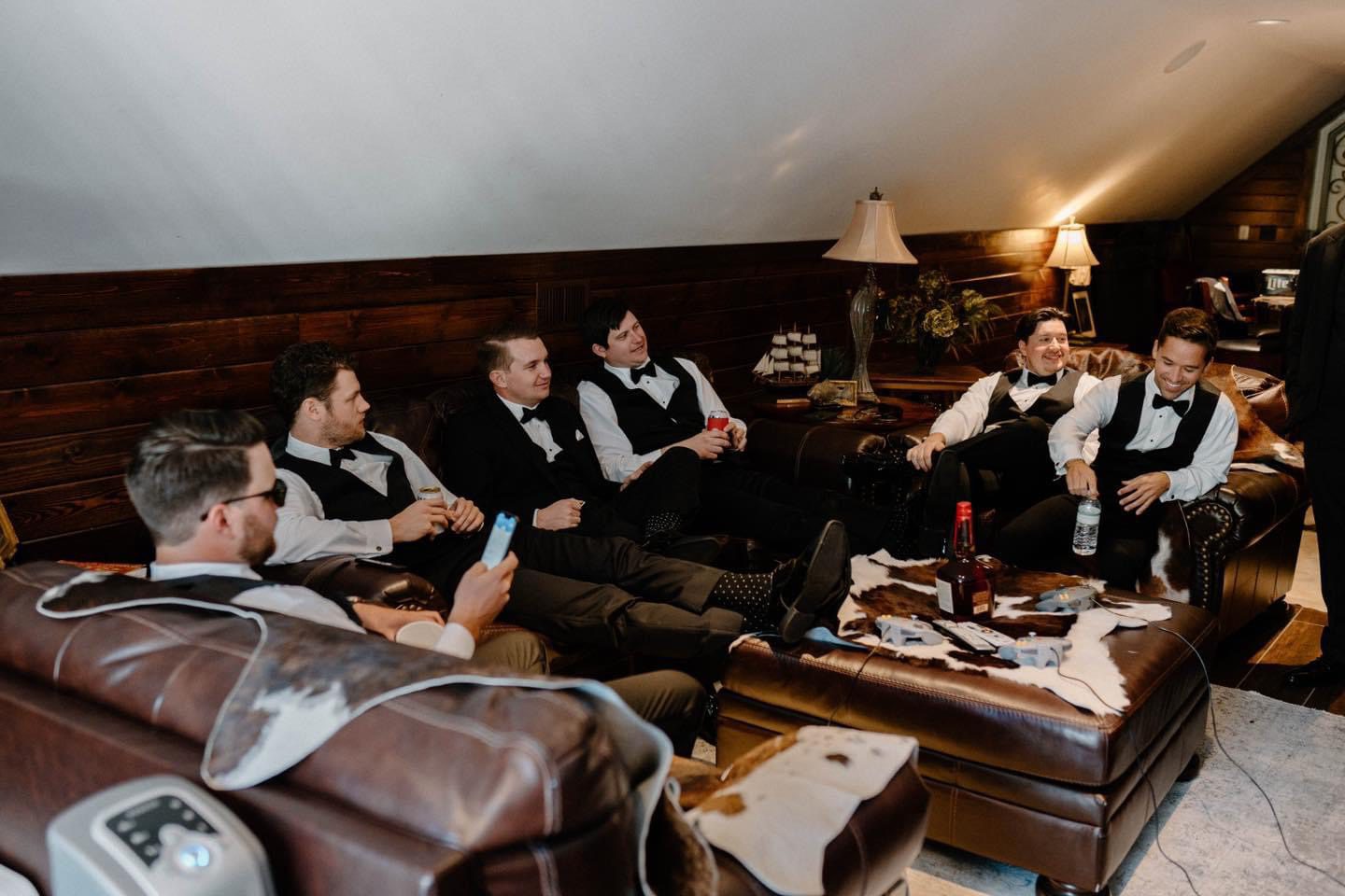 Groomsmen relaxing before wedding ceremony.
