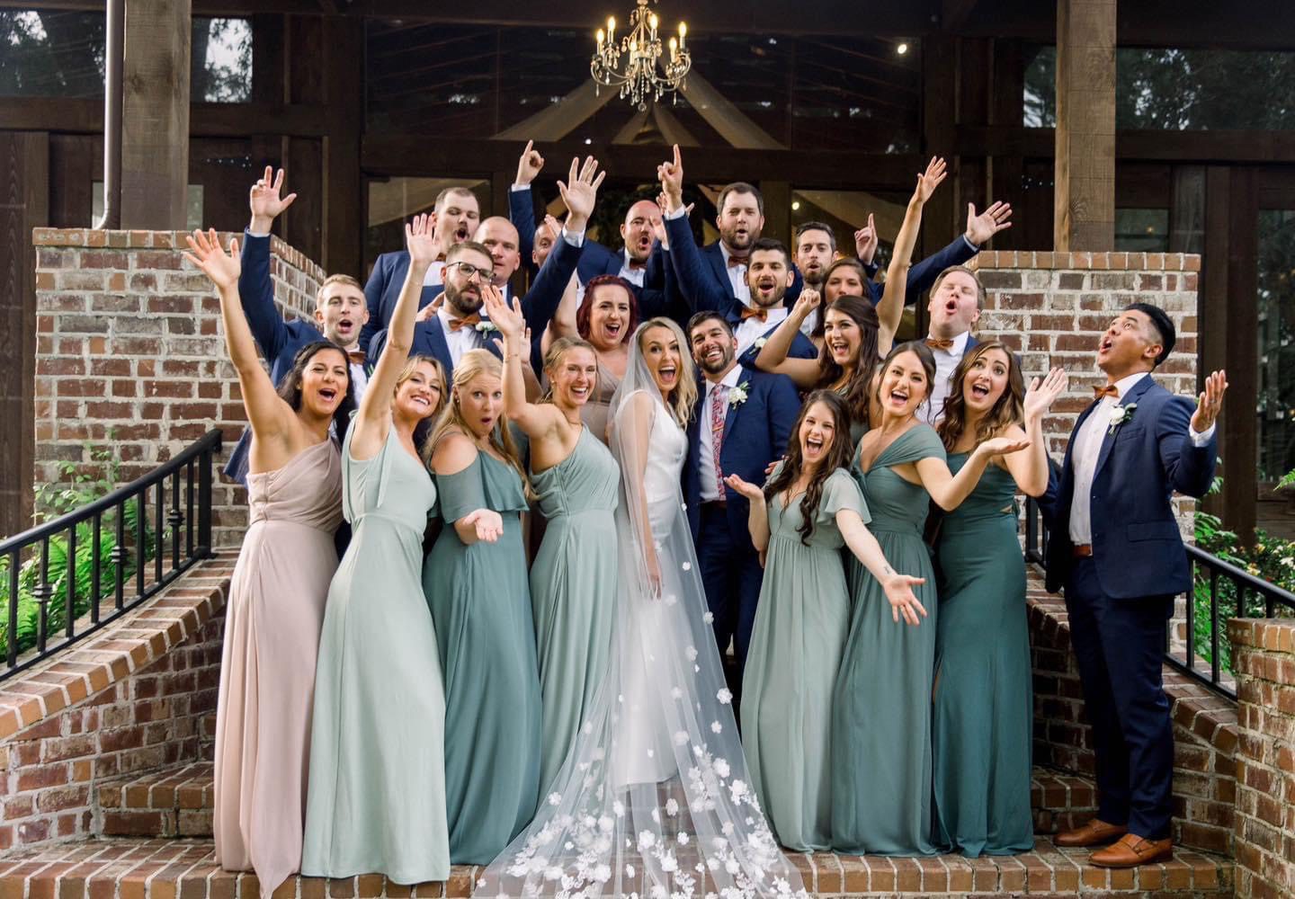 Bride and bridesmaids posing joyfully.