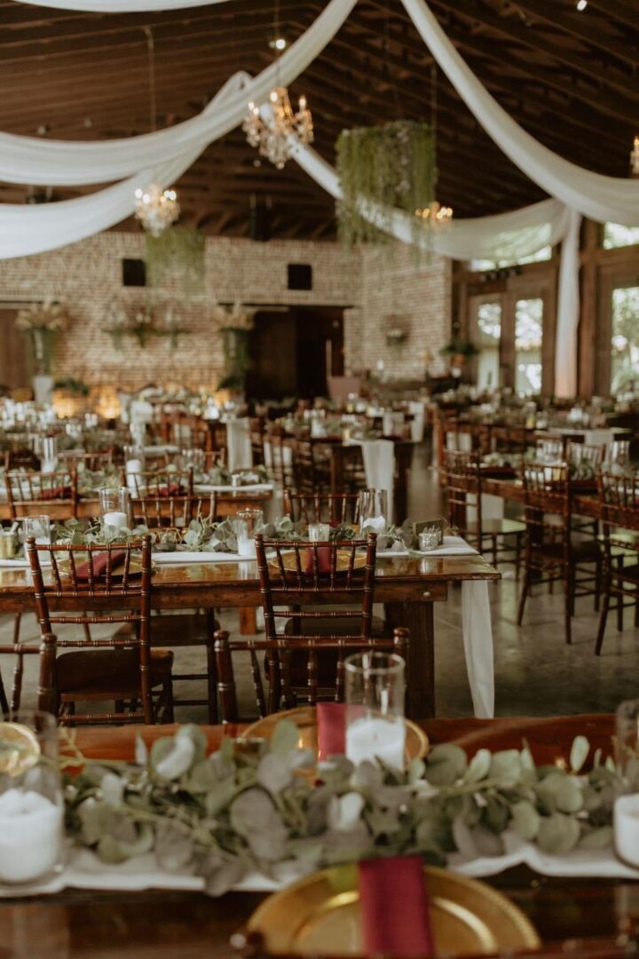 Rustic barn wedding reception tables.