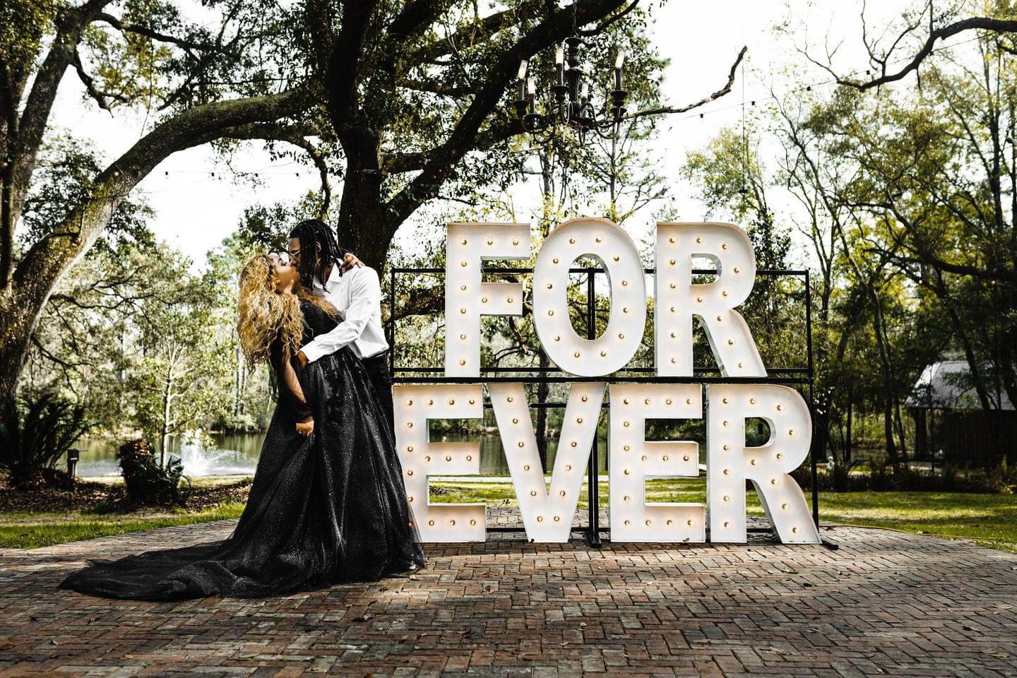 IMG_6251 Couple kissing, forever sign, outdoors.