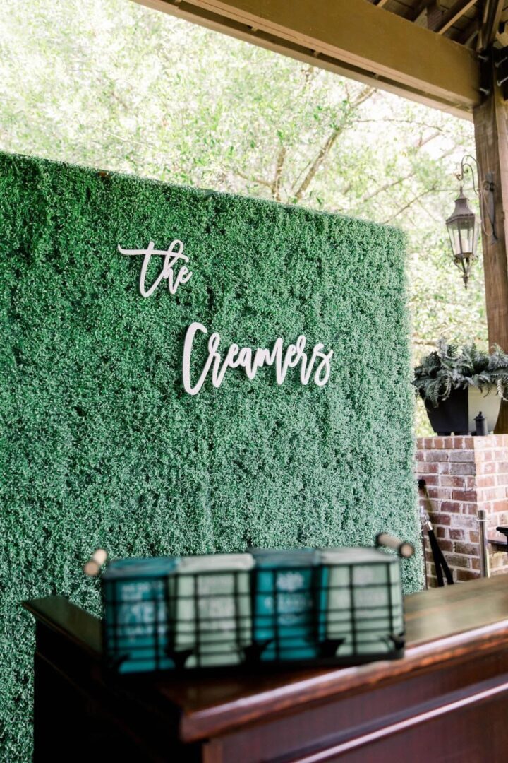 The Creamers wedding backdrop with favors.