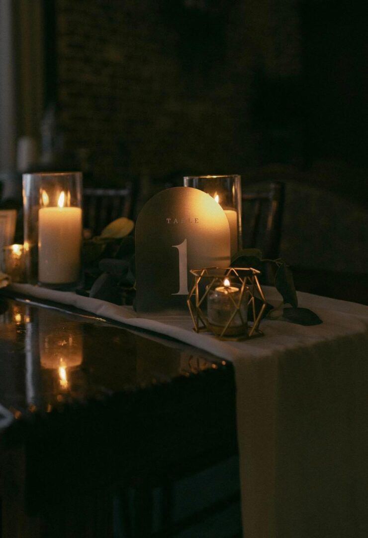 Table one candlelit centerpiece.