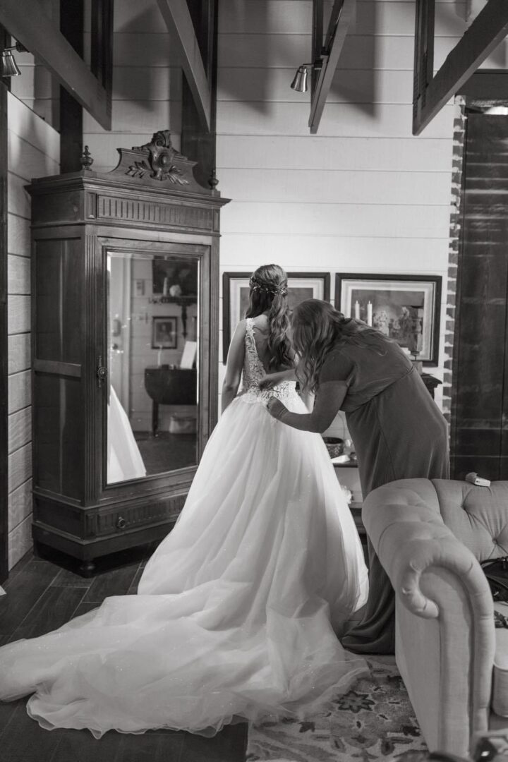 Bride getting dressed for her wedding.