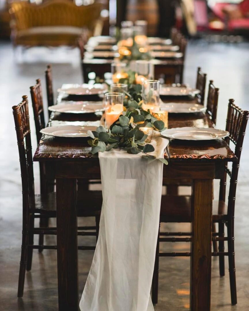 Rustic wedding table setting with candles.