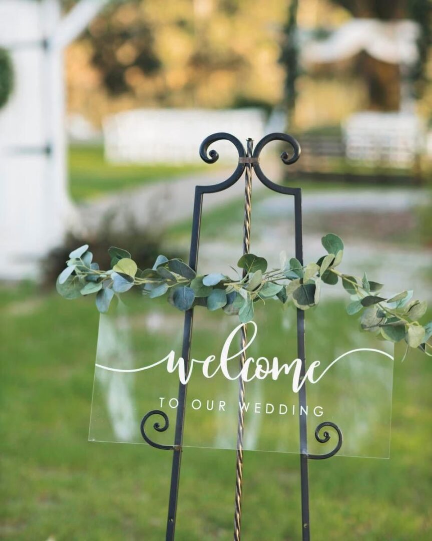 Wedding welcome sign with greenery.