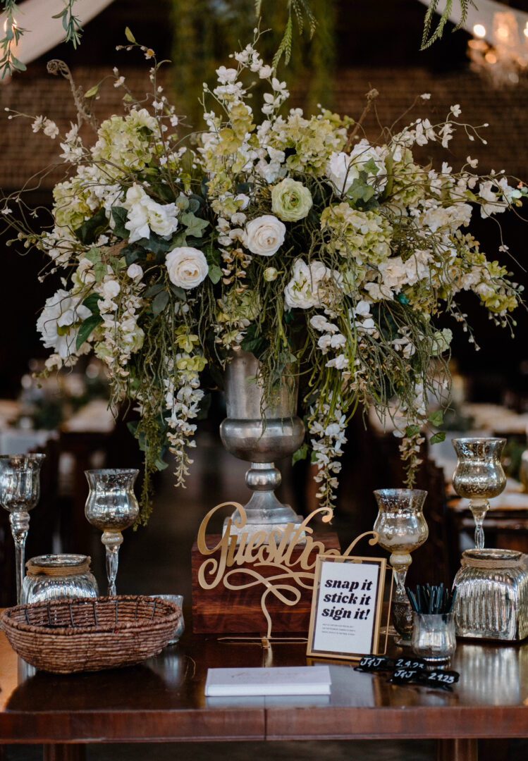 Wedding guest book with floral centerpiece.