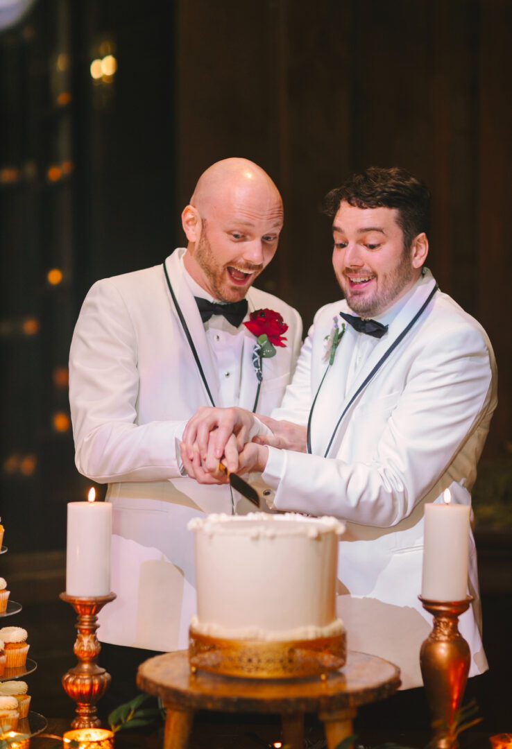 Grooms cutting their wedding cake.