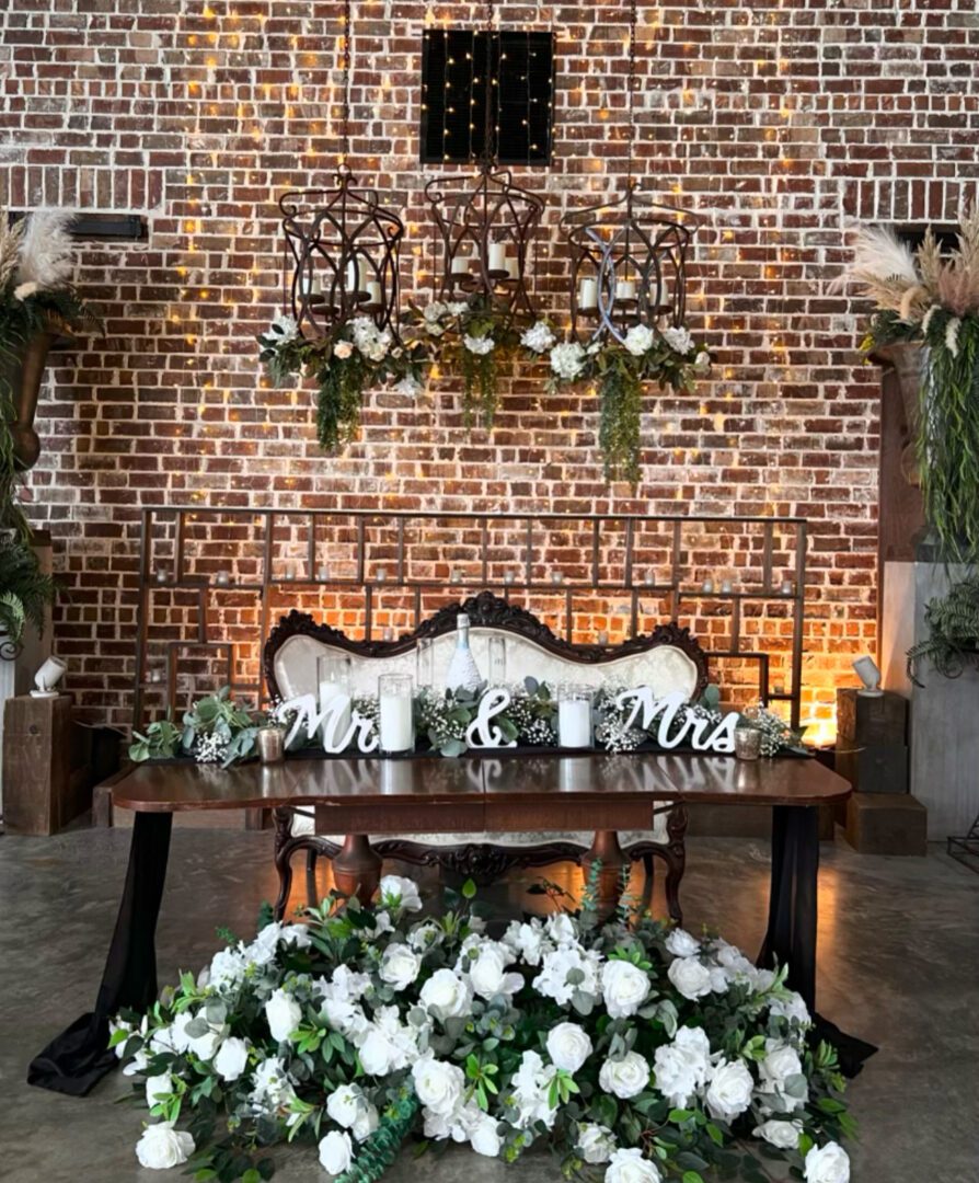 Wedding sweetheart table with flowers.