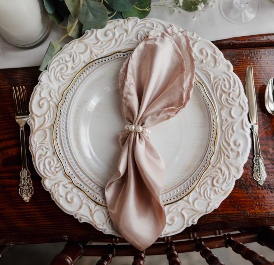 Elegant place setting with pearl napkin ring.