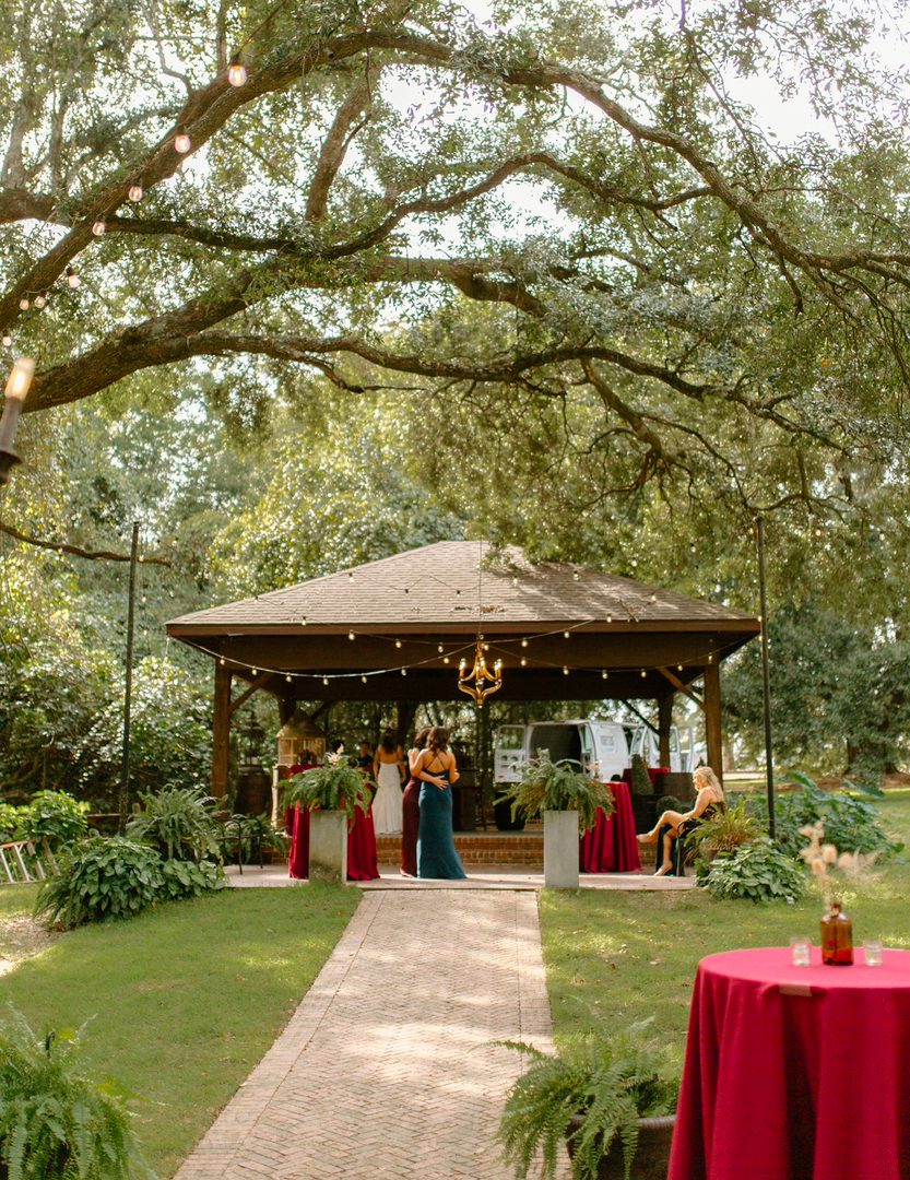 Outdoor wedding ceremony under a tree.
