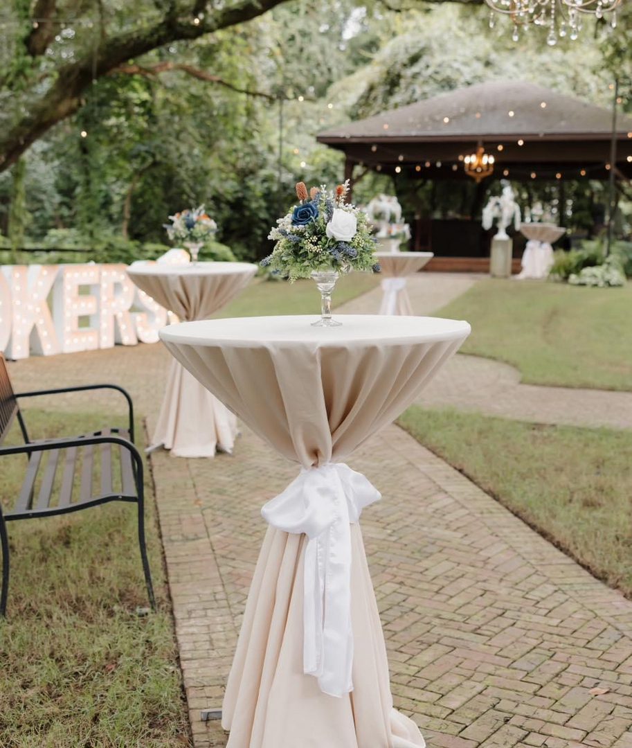 Beige cocktail table with white sash.