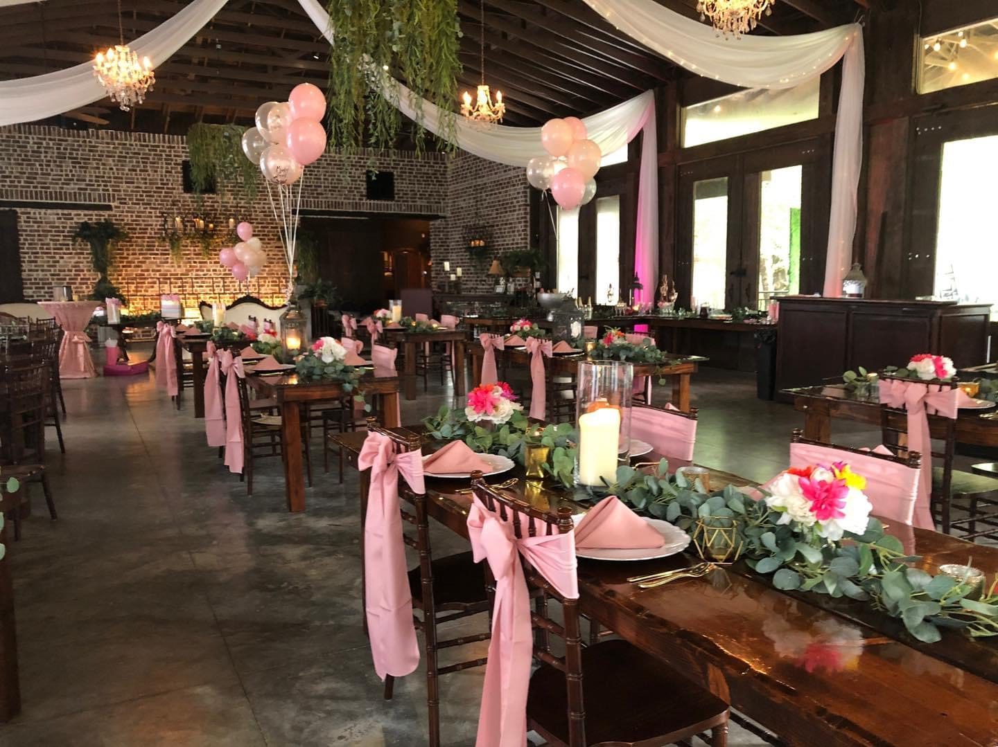 Pink wedding reception, rustic venue.