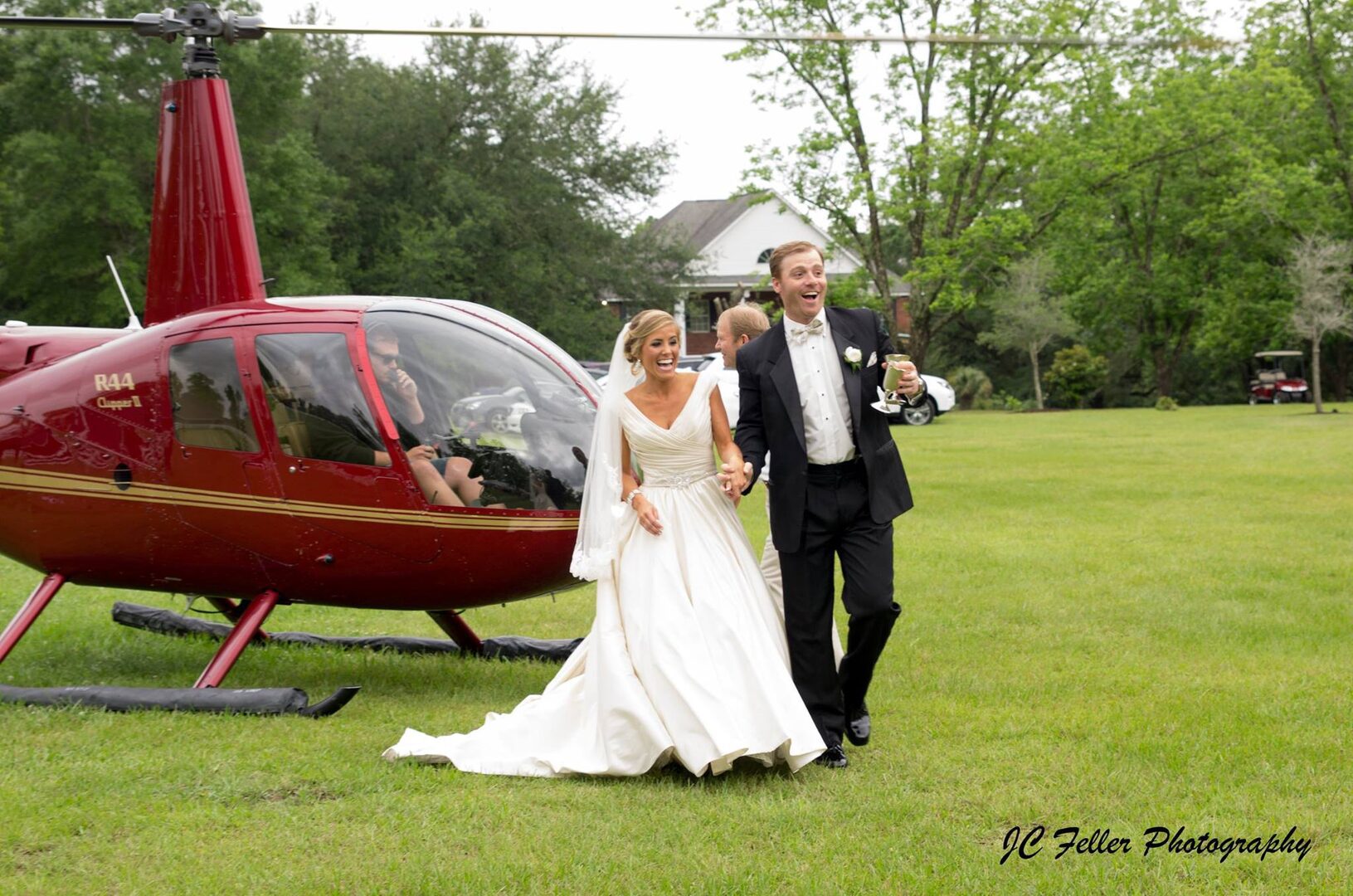 Bride and groom leaving in helicopter.